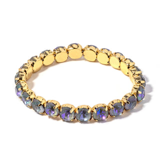 Gold-tone bracelet with dark blue faceted stones and round link settings