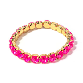 Gold-tone bracelet with bright pink faceted stones and round link settings