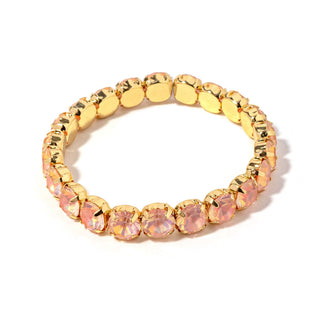 Gold-tone bracelet with oval pink faceted stones and oval gold center links