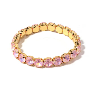 Gold-tone bracelet with oval pastel pink faceted stones and gold disc links