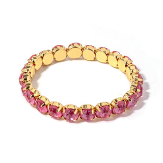 Gold-tone bracelet with fuchsia pink faceted stones and round link settings