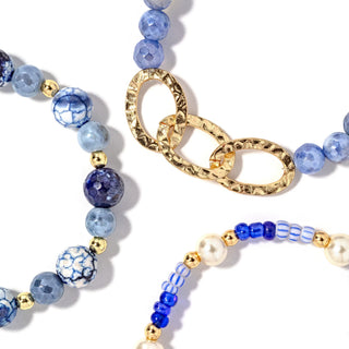 Beaded bracelet set with blue and gold chain links and pearl accents