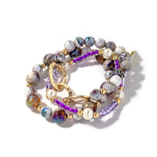 Beaded bracelet set with gray-blue beads, purple accents, gold chain links, and pearls