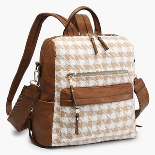 Faux leather houndstooth backpack with brown trim and front zipper pocket