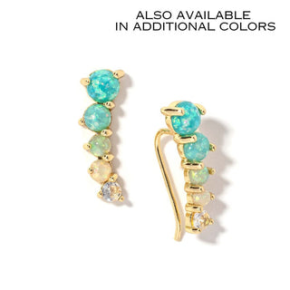 Gold-tone drop earrings with mint oval stones and dangling charms