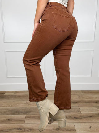Brown mid-rise straight-leg jeans, back yoke and pocket detail, side view