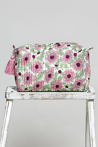 Pink and purple floral POL pouch bag on white with tassel ties and gathered zip top.
