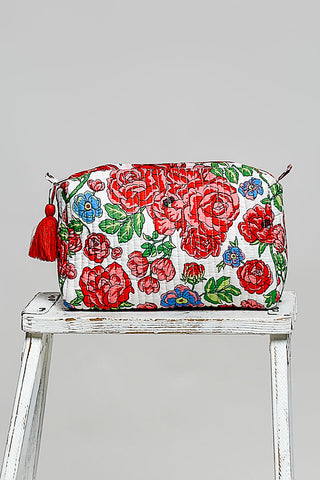 Red rose floral POL pouch bag on white with tassel ties and gathered zip top.