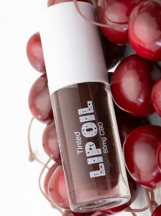 Tinted CBD lip oil, brown shade in clear bottle with white cap, 50mg