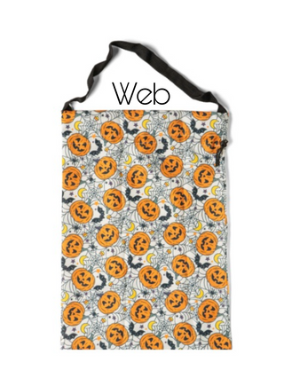 Gray candy bag with orange jack-o'-lanterns and web pattern.
