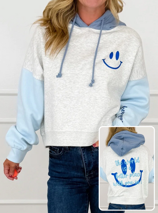 Cropped graphic hoodie in heather grey with blue long sleeves and smiley face chest print