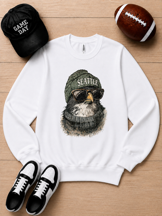 White long sleeve crewneck sweatshirt with Seattle graphic dog wearing a green knit cap.