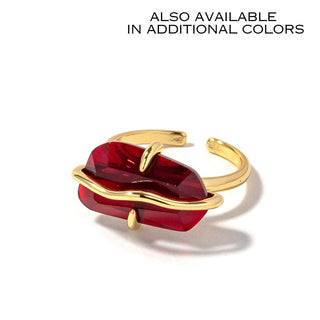Gold-tone open cuff ring with garnet-colored marquise stone