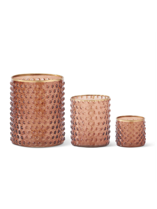 Set of dot-embossed glass containers, three amber sizes with raised dot texture