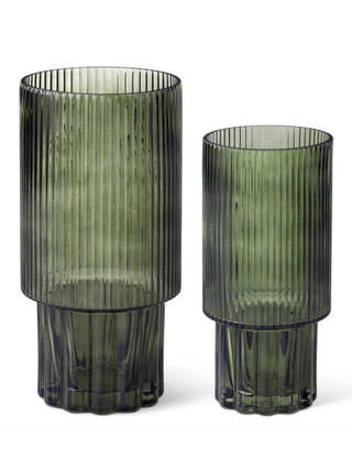 Two ribbed dark-green glass vases, varying heights, with round flared rims