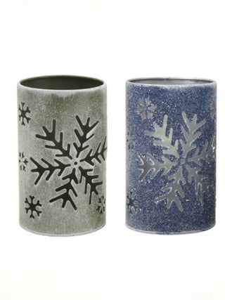 Set of metal holiday candle holders: green and blue cylinders with snowflake cutouts.