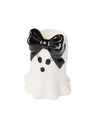 White ceramic ghost candleholder with glossy black bow and face