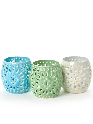 Perforated metal candle holders, blue, green, and white, round cutout design