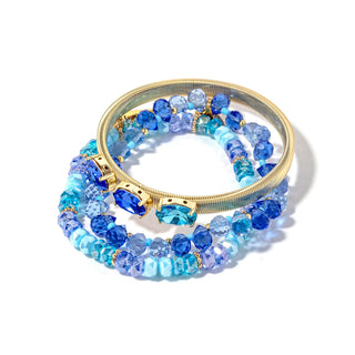Gold-tone beaded bracelet stack in bright blue with faceted crystal stones