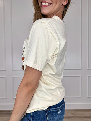 Cream short-sleeve cotton tee, side view with short cuff and visible seams