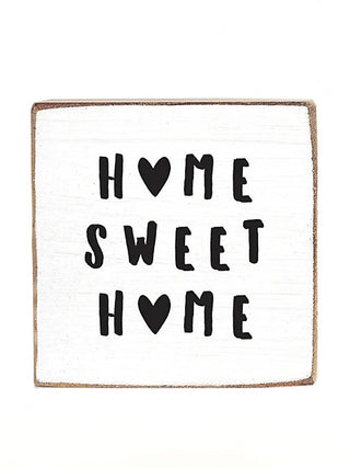 Wood block sign with "Home Sweet Home" text and heart shapes in black