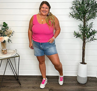 Pink knit tank top with square neckline and sleeveless racerback styling