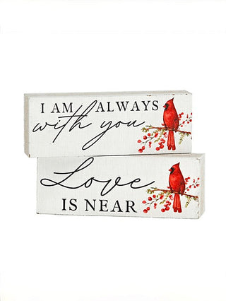 White wood block set with cardinals and "Love is near" quote