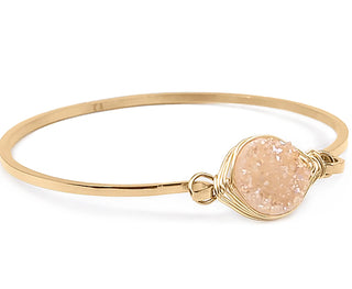 Gold-tone bangle bracelet with wire-wrapped oval druzy stone
