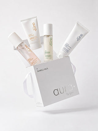 AURA Core 4 bundle pack with box, skincare tubes, and spray bottle