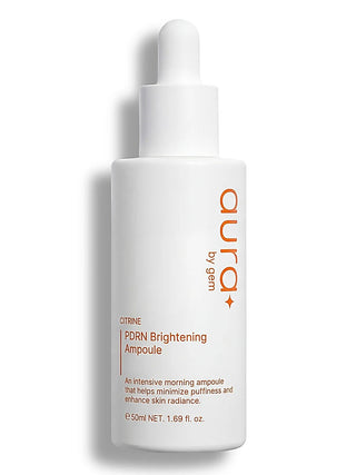 Brightening ampoule with dropper, white bottle with orange label accents