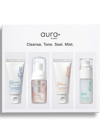 AURA travel skin care kit in box with cleanser, toner, seal, and mist bottles