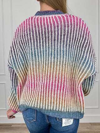 Striped multi-color knit cardigan, back view, long sleeves; pink and blue with cream base