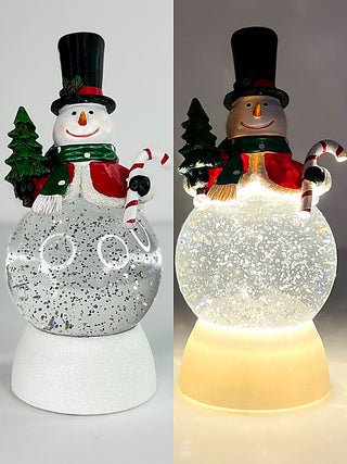 Snowman LED water lanterns, one lit with warm glow inside an illuminated glass body