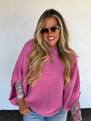 Purple knit poncho top with mock neck and relaxed draped 3/4 sleeves