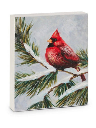 Cardinal wood block sign showing red bird on snowy branch with pine needles