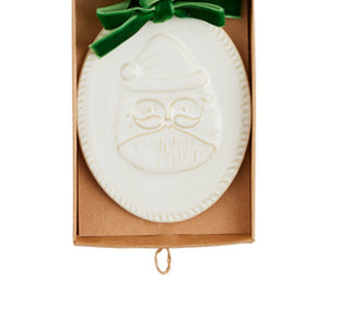 Milk-glazed stoneware Santa Christmas ornament with green bow ribbon loop for hanging