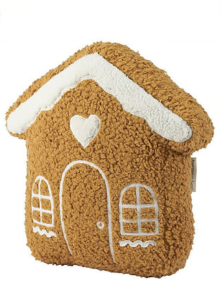 Brown house-shaped decorative pillow with white trim, heart window, and door detail