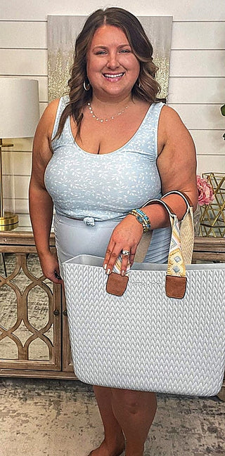 Light blue tank swim top with scoop neckline and subtle speckle texture