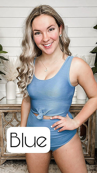 Knotted swim top in blue ribbed knit with center knot detail