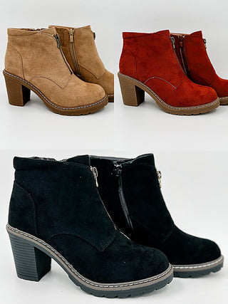 Faux suede ankle booties in tan, rust red, and dark navy/black, side-zip.