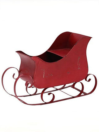 Red distressed sleigh decor with curled metal runners and front opening
