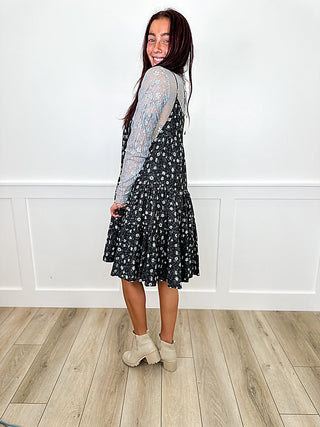 Lightweight black patterned A-line dress, side view, long sheer sleeves