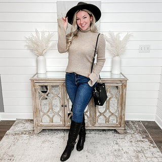 Oatmeal knit long-sleeve turtleneck sweater with fitted sleeves and ribbed hem