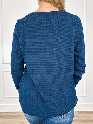 Blue knit sweater top with crewneck, back view