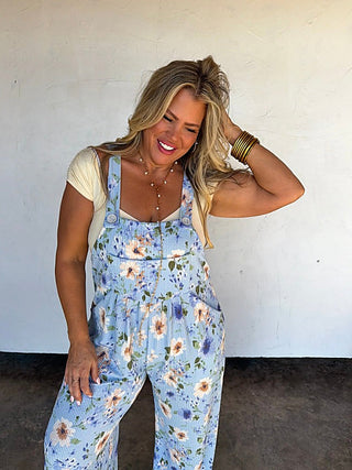 Blue floral ribbed overalls with adjustable straps and wide legs