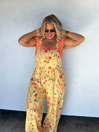 Yellow floral ribbed overalls with adjustable straps and wide legs