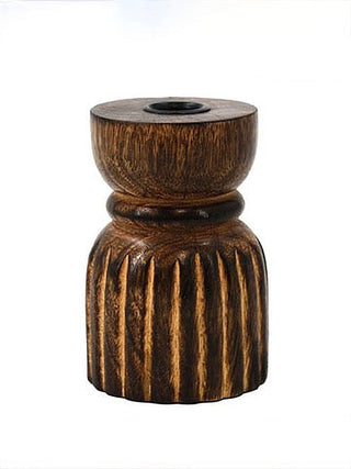 Carved wooden candle holder with round top cup and dark interior