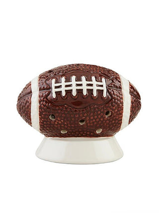 Ceramic light-up shelf sitter shaped like a brown football with white laces details