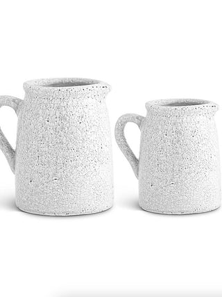 Set of two speckled ceramic pitchers with short side handles and wide openings