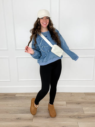 Denim patchwork cropped top with black leggings, light crossbody bag strap